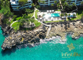 Гостиница Infiniti Blu Luxury Ocean Front Condos  Сосуа